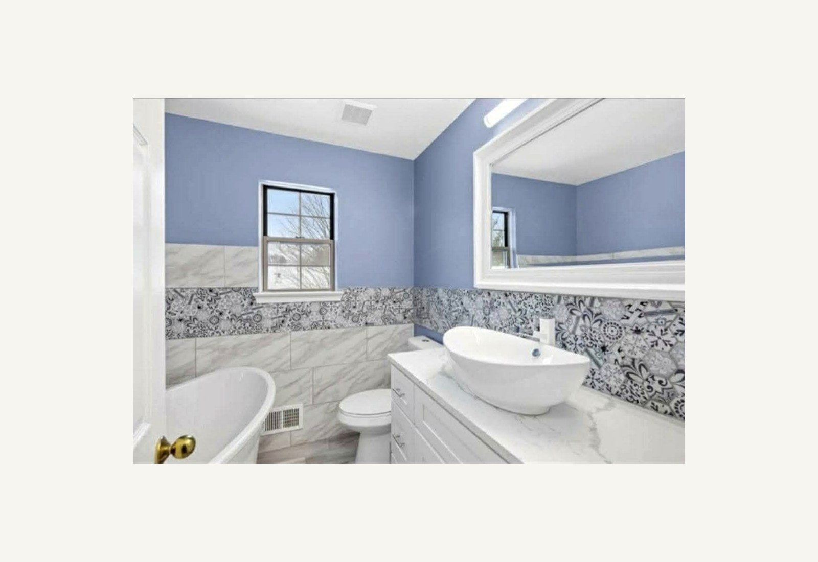 Reliable Renovators bathroom after photo with blue wall tile and vessel sink in Metro Detroit