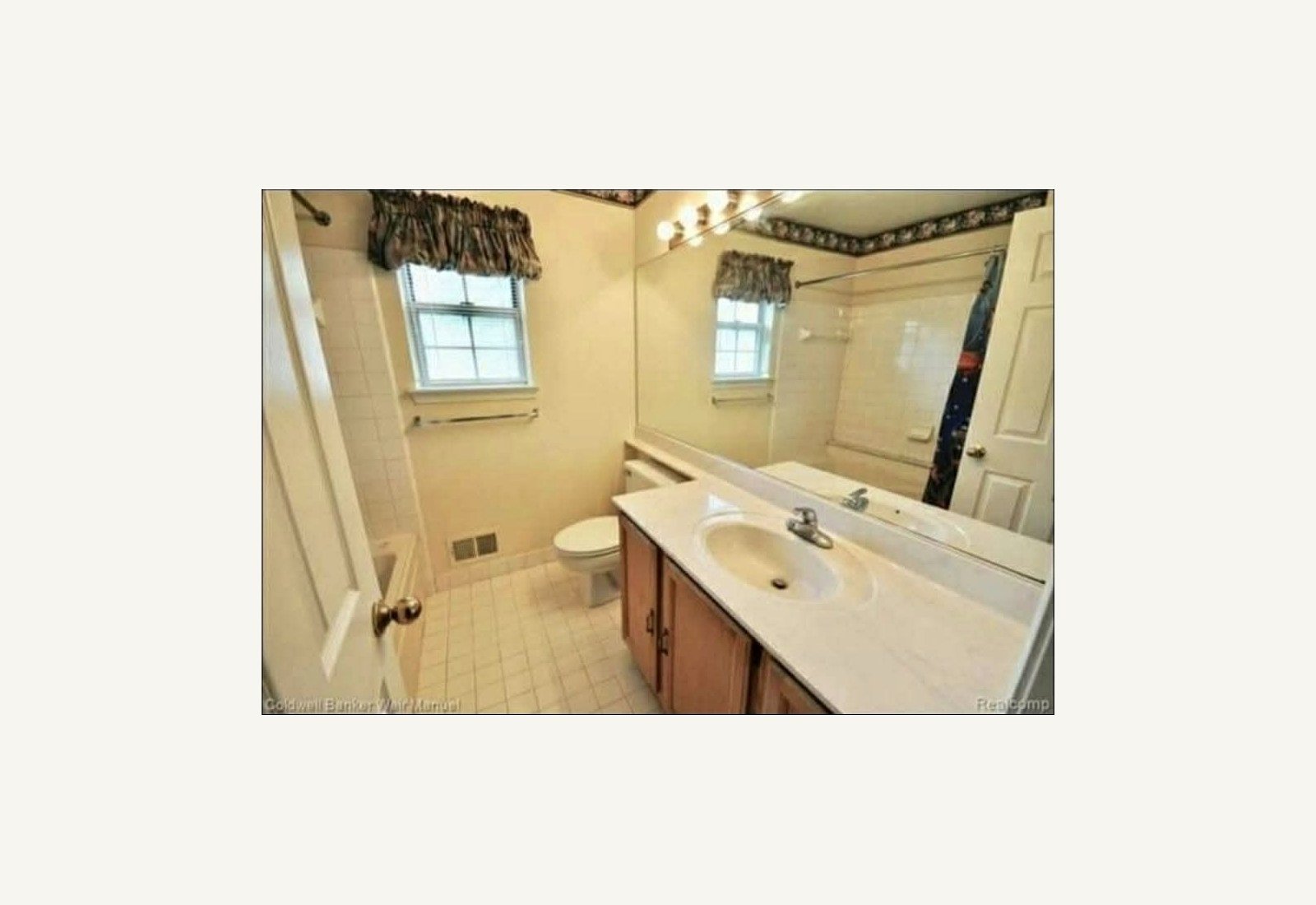 Reliable Renovators bathroom before photo with yellow tile and older vanity in Metro Detroit