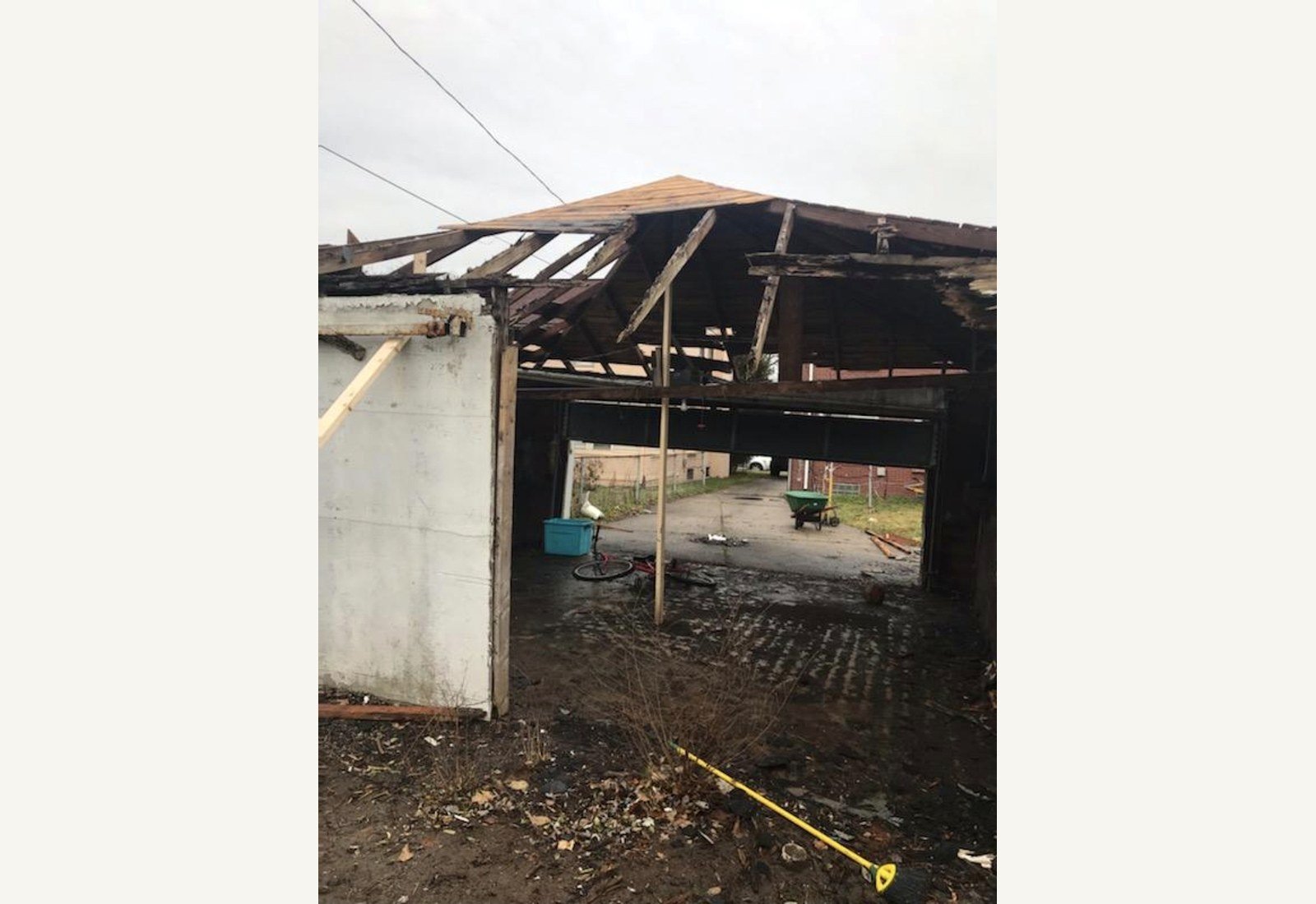Reliable Renovators fire damaged garage before repair with open damaged structure in Metro Detroit