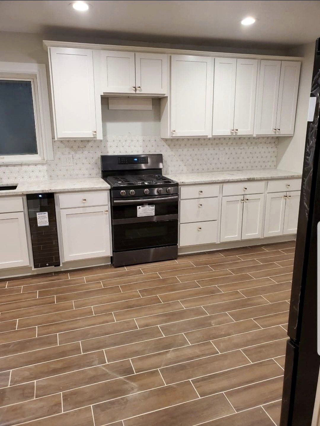 Reliable Renovators finished kitchen flooring paint and trim work in Metro Detroit